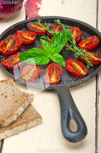 Image of baked cherry tomatoes with basil and thyme