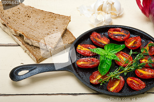 Image of baked cherry tomatoes with basil and thyme