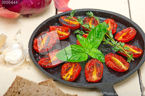 Image of baked cherry tomatoes with basil and thyme