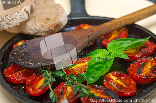 Image of baked cherry tomatoes with basil and thyme