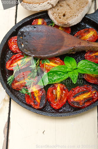 Image of baked cherry tomatoes with basil and thyme