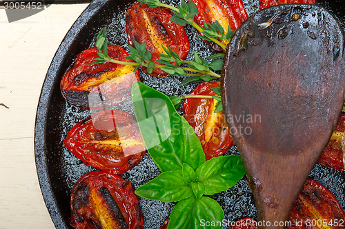 Image of baked cherry tomatoes with basil and thyme