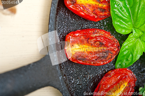 Image of baked cherry tomatoes with basil and thyme