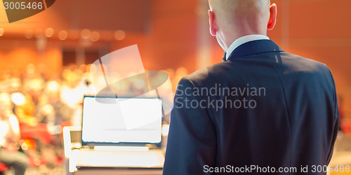 Image of Public speaker at Business Conference.