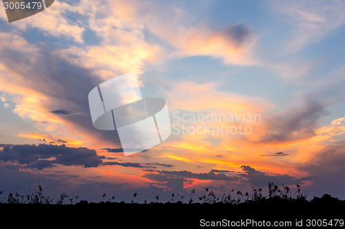 Image of African sunset with dramatic clouds on sky