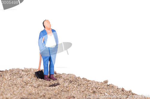 Image of Miniature worker with a shovel