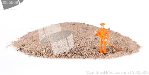 Image of Miniature worker is cleaning a keyboard