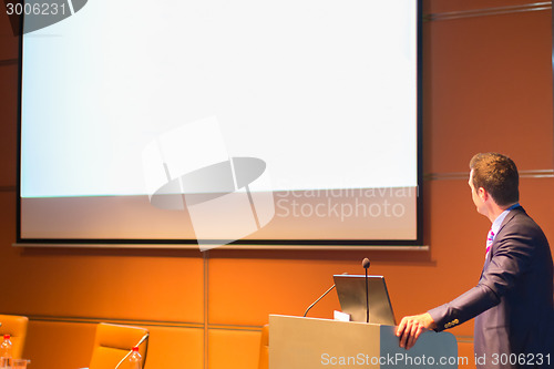 Image of Public speaker at Business Conference.