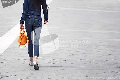 Image of Woman with orange bag