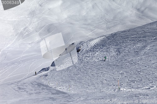 Image of Skiers on off-piste slope in nice sun day