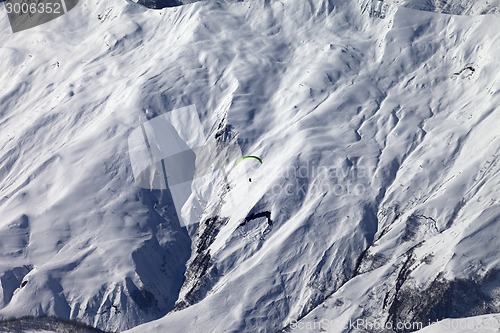 Image of Speed flying in winter mountains in sun nice day