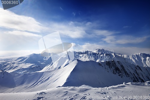 Image of Snowy mountains and sunlight sky