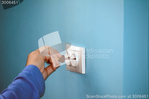 Image of Electrician fixing the socket