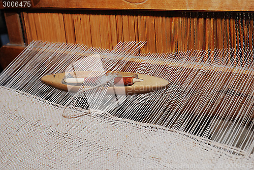 Image of shuttle on the antique loom