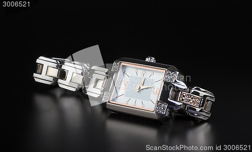 Image of photo luxury woman’s watch on black 