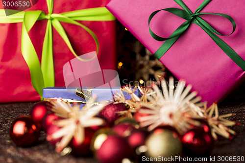 Image of Ribbons, gifts, baubles and straw stars
