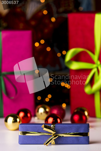 Image of Baubles, twinkles and three wrapped gifts
