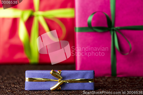 Image of Three presents, bows and ribbons
