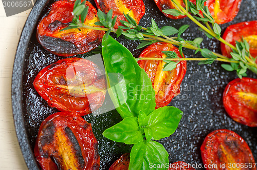 Image of baked cherry tomatoes with basil and thyme