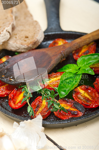 Image of baked cherry tomatoes with basil and thyme