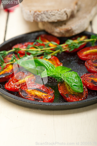 Image of baked cherry tomatoes with basil and thyme