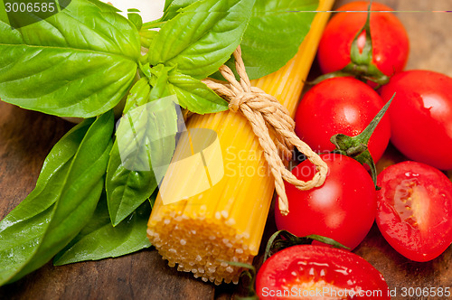 Image of Italian spaghetti pasta tomato and basil