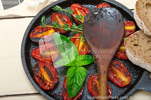 Image of baked cherry tomatoes with basil and thyme