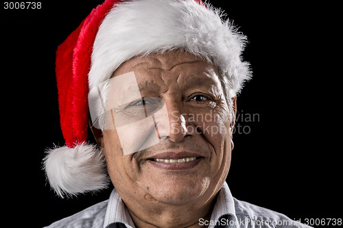 Image of Venerable Man with Red Father Christmas Cap