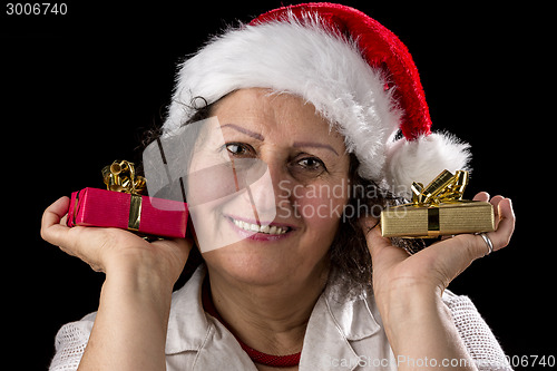 Image of Gentle Aged Woman Holging Two Small Gifts