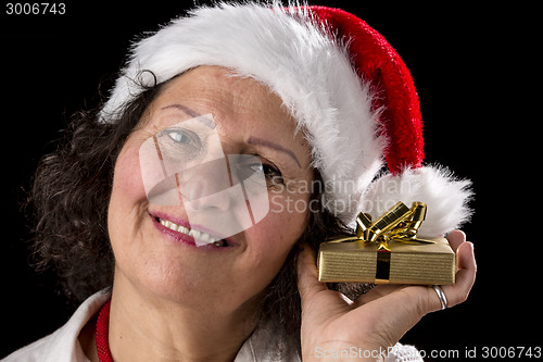 Image of Middle-Aged Woman Holding Golden Gift