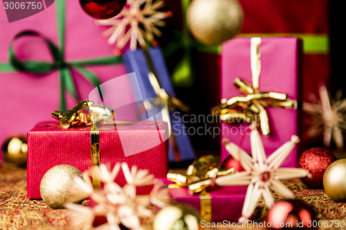 Image of Red Present among other Gifts and Baubles