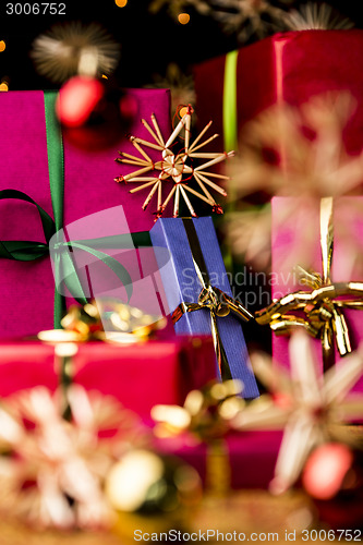 Image of Blue Present amidst Straw Stars