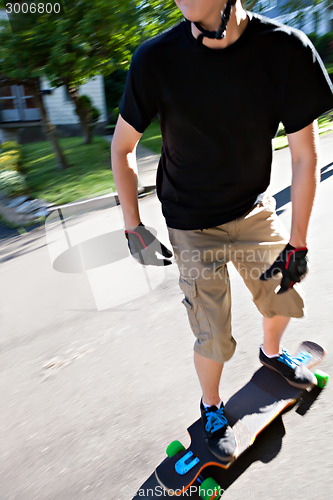 Image of Teen Longboarding