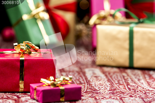 Image of Red Present Among Other Gifts