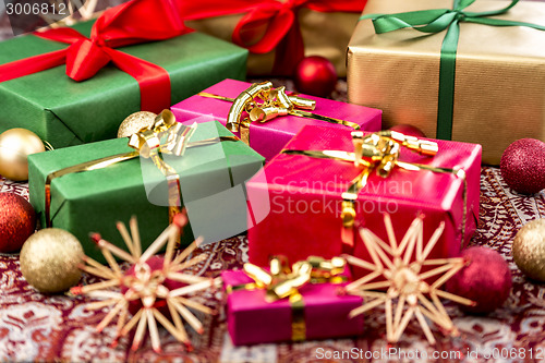 Image of Xmas Presents with Bows, Baubles and Stars