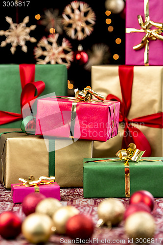 Image of Xmas Gifts Between Ornaments and Stars