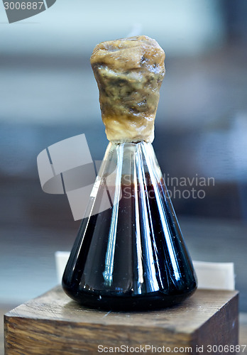 Image of small vial with petroleum oil