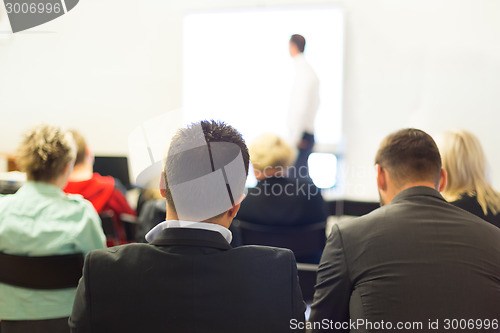 Image of Speaker at Business convention and Presentation.