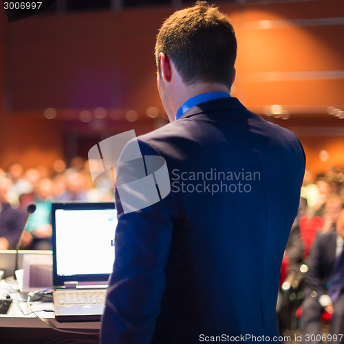 Image of Public speaker at Business Conference.