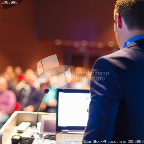 Image of Public speaker at Business Conference.