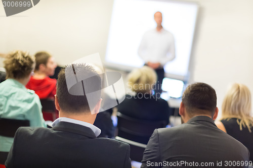 Image of Speaker at Business convention and Presentation.