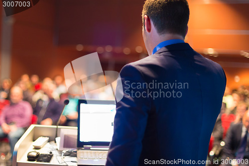 Image of Public speaker at Business Conference.