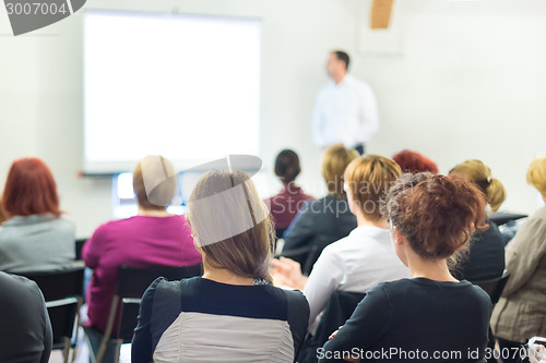 Image of Speaker at Business convention and Presentation.