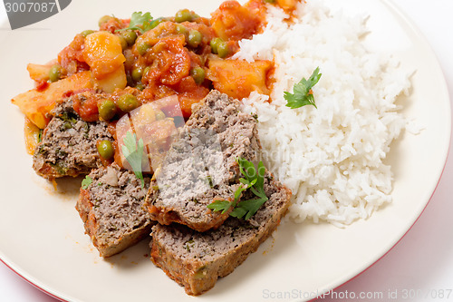Image of Meatloaf with tomato sauce and rice