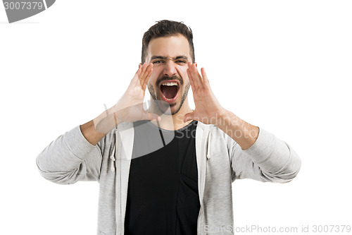 Image of Man shouting through the hands