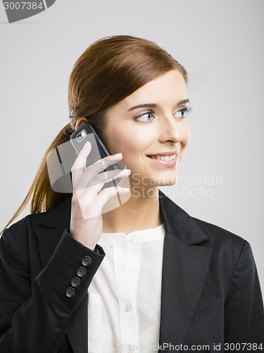 Image of Business woman making phone call