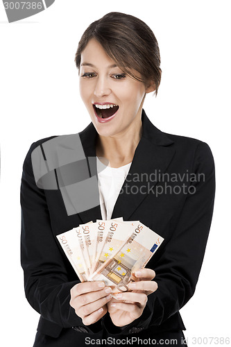 Image of Woman holding euro currency notes