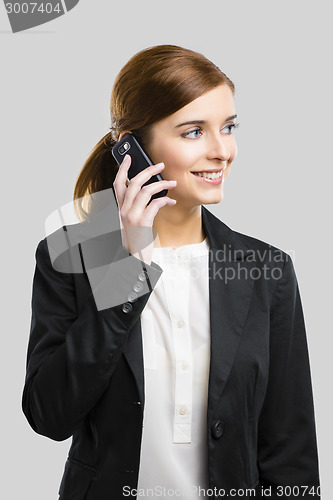 Image of Business woman making phone call