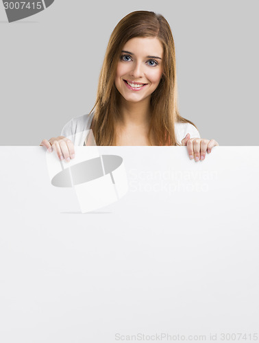Image of Woman with a big blank board