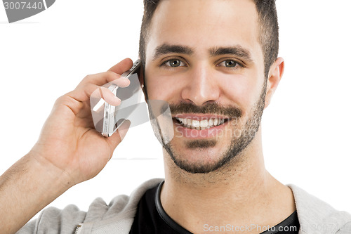 Image of Young man talking on cell phone